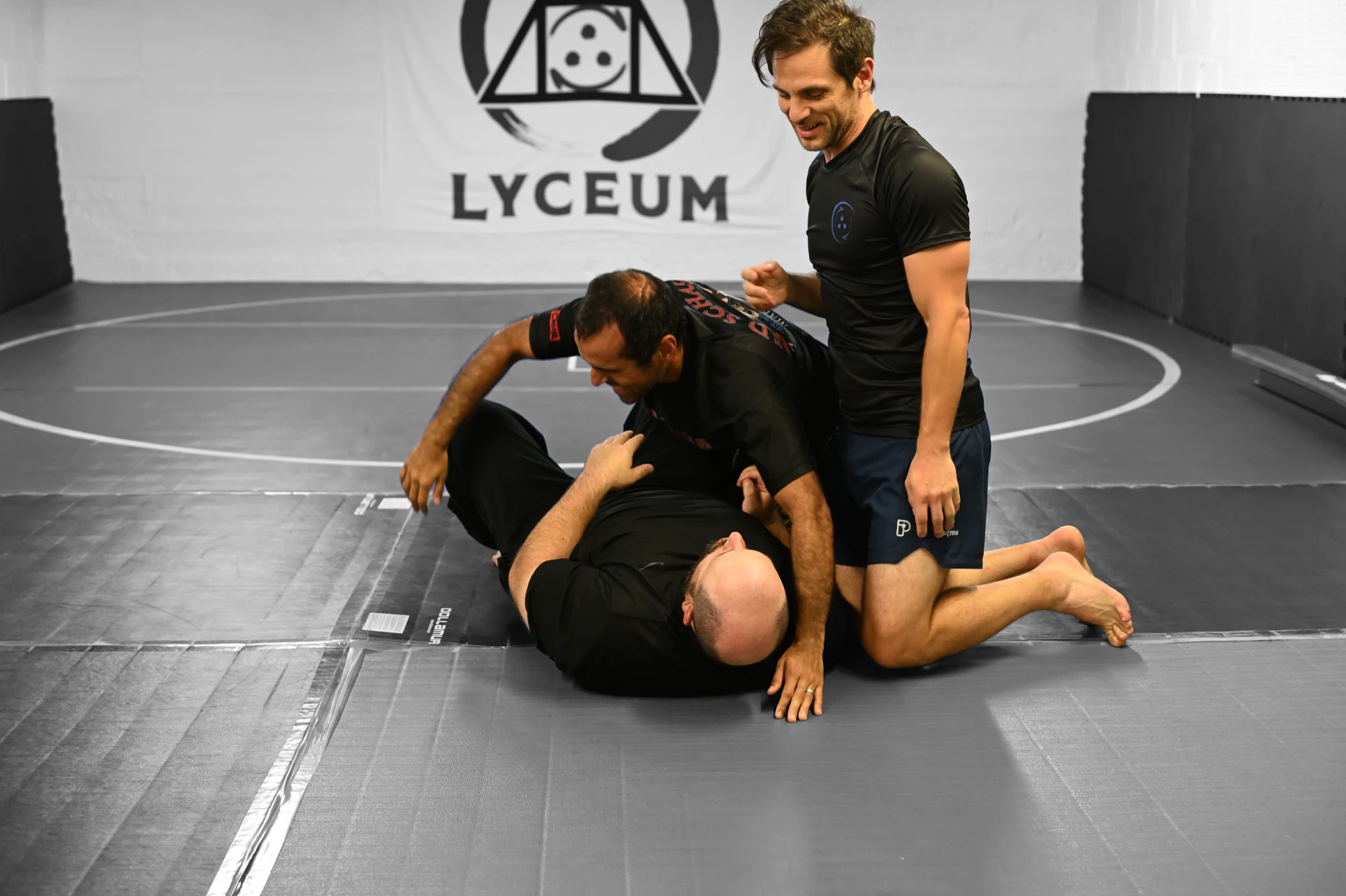Grappling partners working on position on the mat